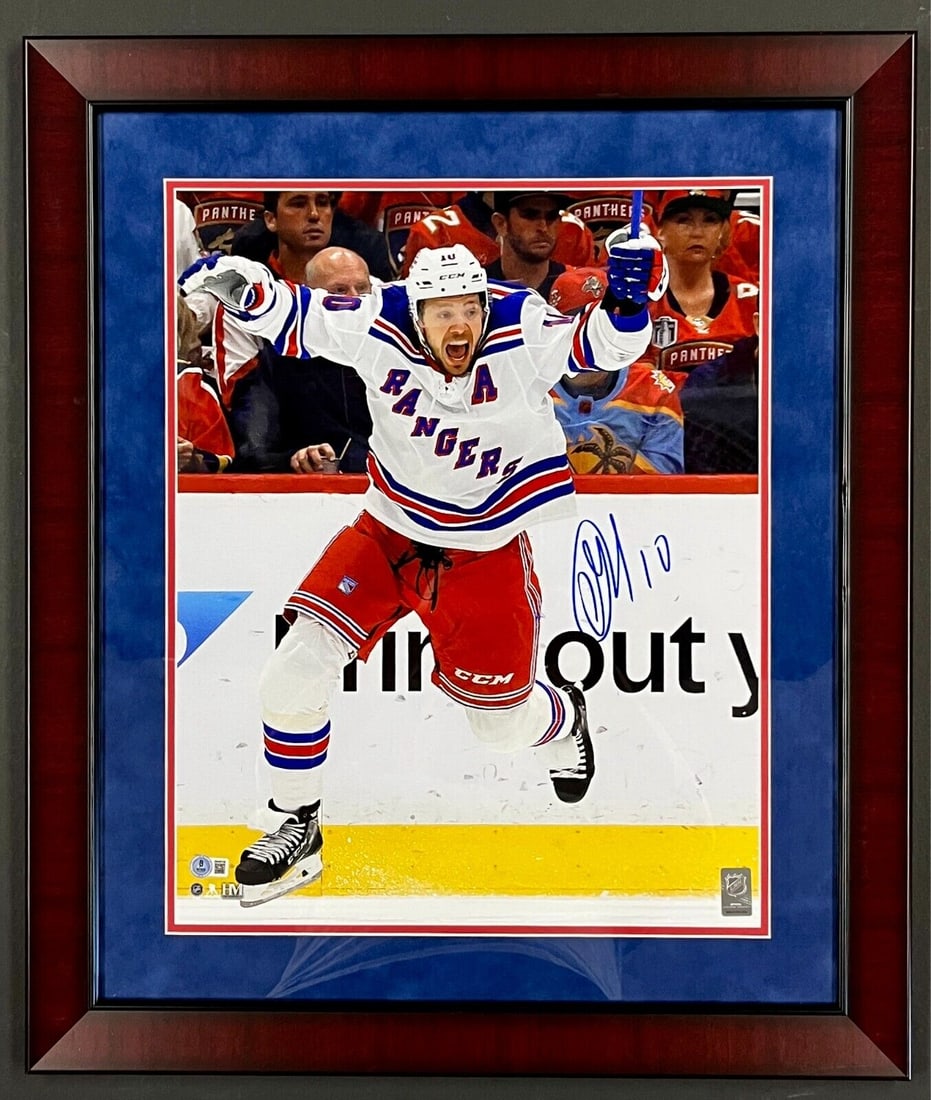 Artemi Panarin signed 16x20 custom framed photo display: Artemi Panarin signed 16x20 custom framed photo display This custom framed display features a stunning 16x20 photograph of hockey player Artemi Panarin celebrating a moment on the ice. The photo is no