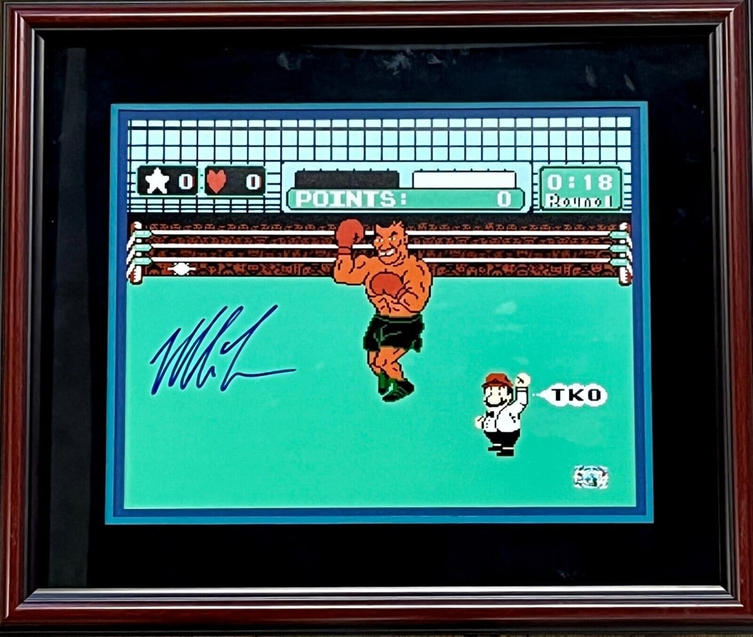 MIKE TYSON signed 11x14 photo custom framed display: MIKE TYSON signed 11x14 photo custom framed display This impressive custom framed display features an 11x14 photo of boxing legend Mike Tyson from the classic Nintendo game Punch Out. The photo is sig
