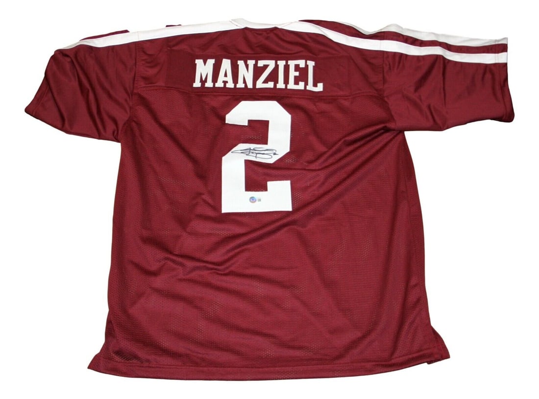 Johnny Manziel Autographed Texas A&M Jersey: Johnny Manziel Autographed Texas A&M Jersey This authentic Texas A&M jersey is signed by Johnny Manziel, showcasing his name and number '2' on the back. The jersey is a must-have for any football fan