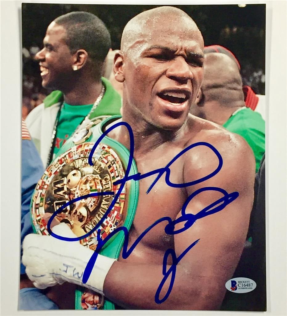 Floyd Mayweather Jr. Signed 8x10 Photo with Huge Full Autograph: Floyd Mayweather Jr. Signed 8x10 Photo with Huge Full Autograph This item features an 8x10 signed photograph of boxing champion Floyd Mayweather Jr. showcasing him holding a championship belt. The aut
