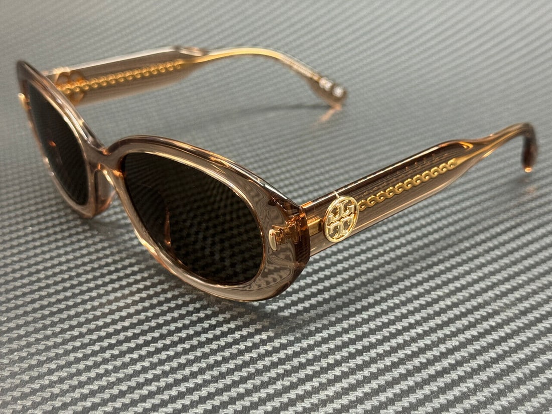 Tory Burch TY7214U 195473 Brown Women's Sunglasses: Tory Burch TY7214U 195473 Brown Women's Sunglasses Elevate your eyewear collection with these Tory Burch TY7214U 195473 sunglasses. Featuring a stylish transparent brown frame complemented by dark len