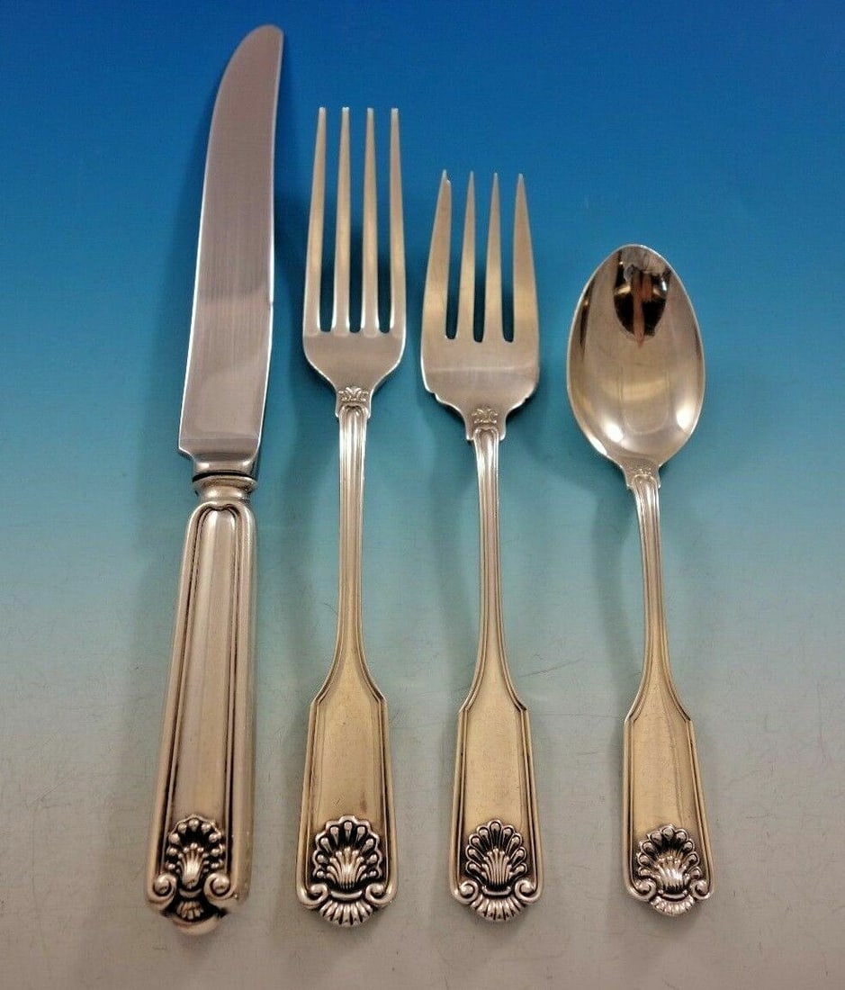 Fiddle Shell Sterling Silver Regular Setting 4-Piece: Fiddle Shell Sterling Silver Regular Setting 4-Piece This exquisite 4-piece flatware set features the classic Fiddle Shell pattern by Frank Smith, crafted from high-quality sterling silver. The set in