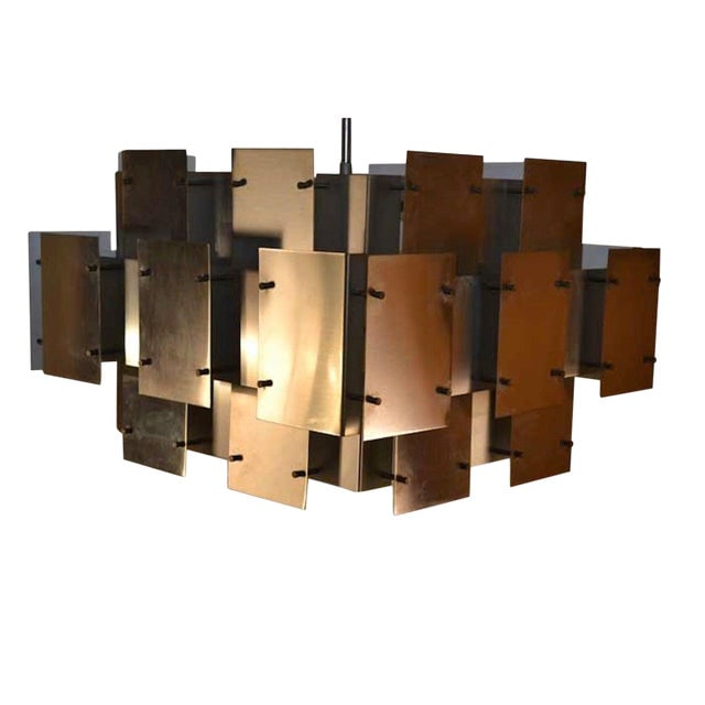 Modernist Steel and Brass Brutalist Chandelier: Modernist Steel and Brass Brutalist Chandelier This stunning Robert Sonneman "Cityscape" Brutalist Chandelier features a modernist design crafted from sheet steel and brass. Measuring 23"W x 21"D x 15