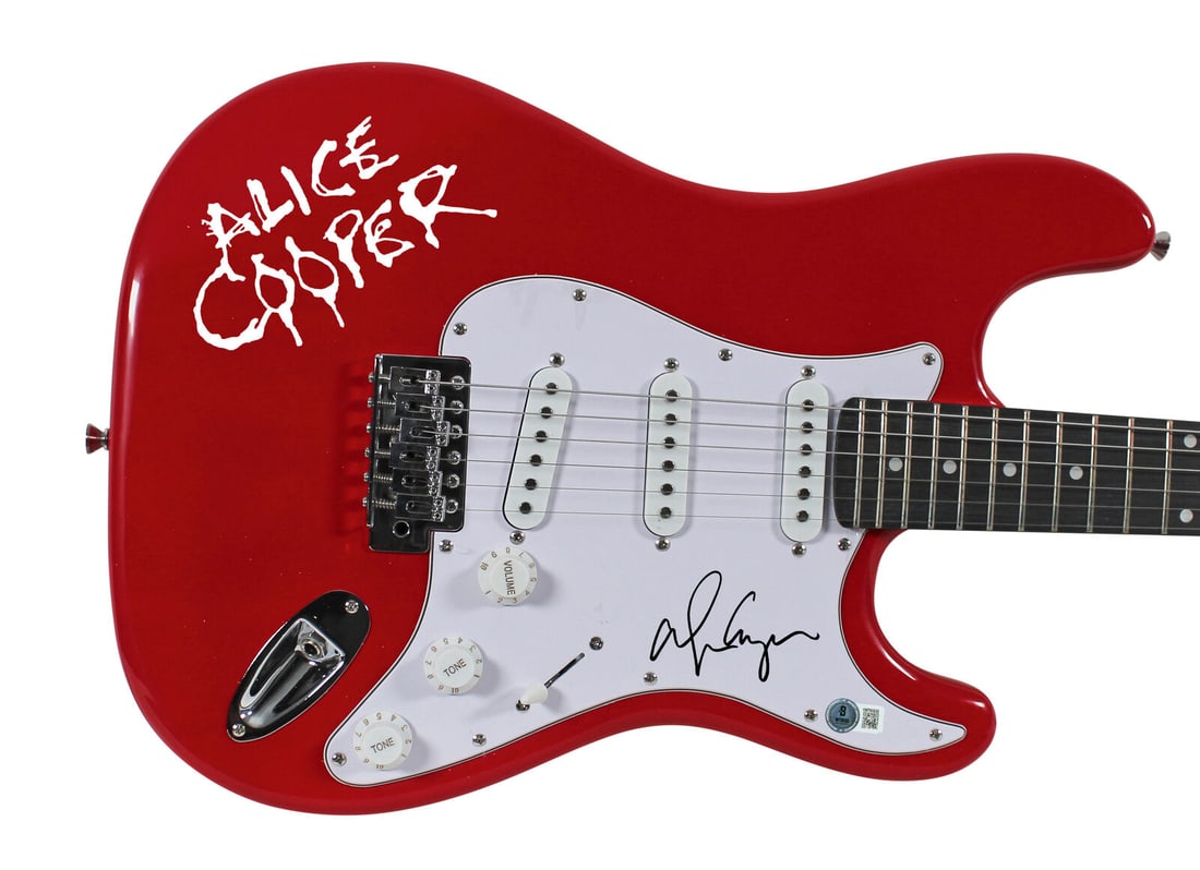 Alice Cooper Signed Red Electric Guitar with Decal: Alice Cooper Signed Red Electric Guitar with Decal This authentic red electric guitar, signed by the legendary Alice Cooper, is a must-have for music enthusiasts and collectors alike. Featuring a stri