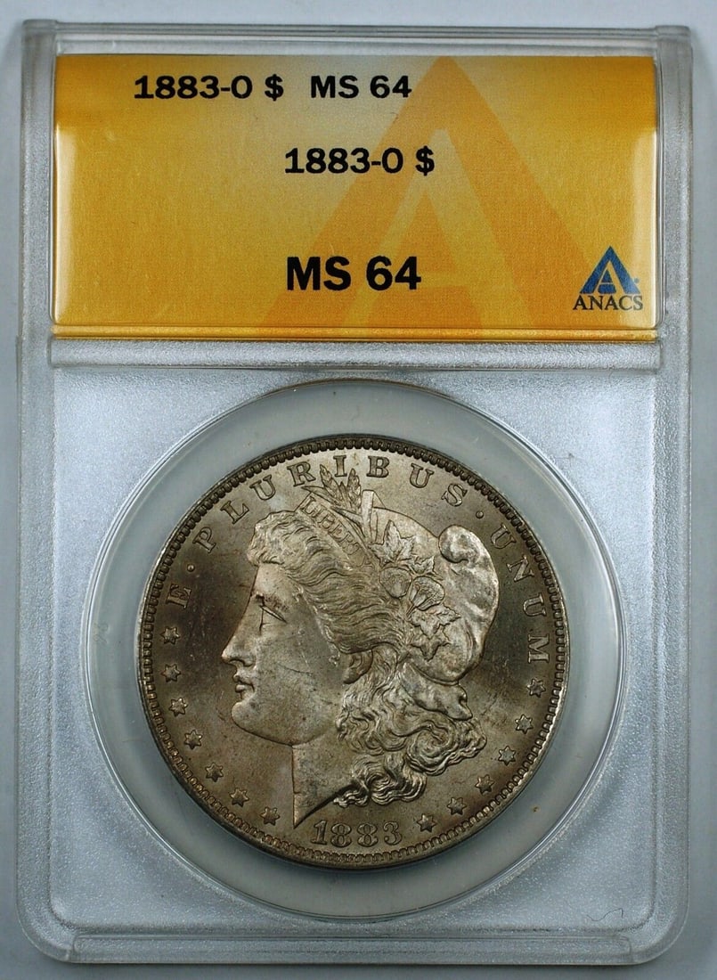 1883-O Morgan Silver Dollar Coin, ANACS MS-64, Uncirculated: 1883-O Morgan Silver Dollar Coin, ANACS MS-64, Uncirculated This 1883-O Morgan Silver Dollar Coin is graded MS-64 by ANACS, indicating it is in uncirculated condition. Minted in New Orleans, this coin