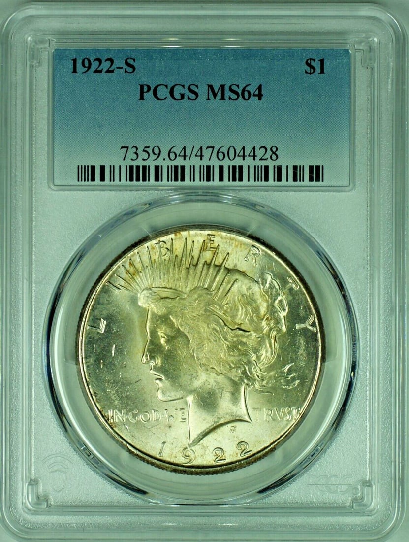 1922 Peace Silver Dollar $1 Coin MS 64: 1922 Peace Silver Dollar $1 Coin MS 64 This 1922-S Peace Silver Dollar is a stunning example of American coinage, showcasing a grade of MS 64 by PCGS. The coin is made of high-quality silver and featu