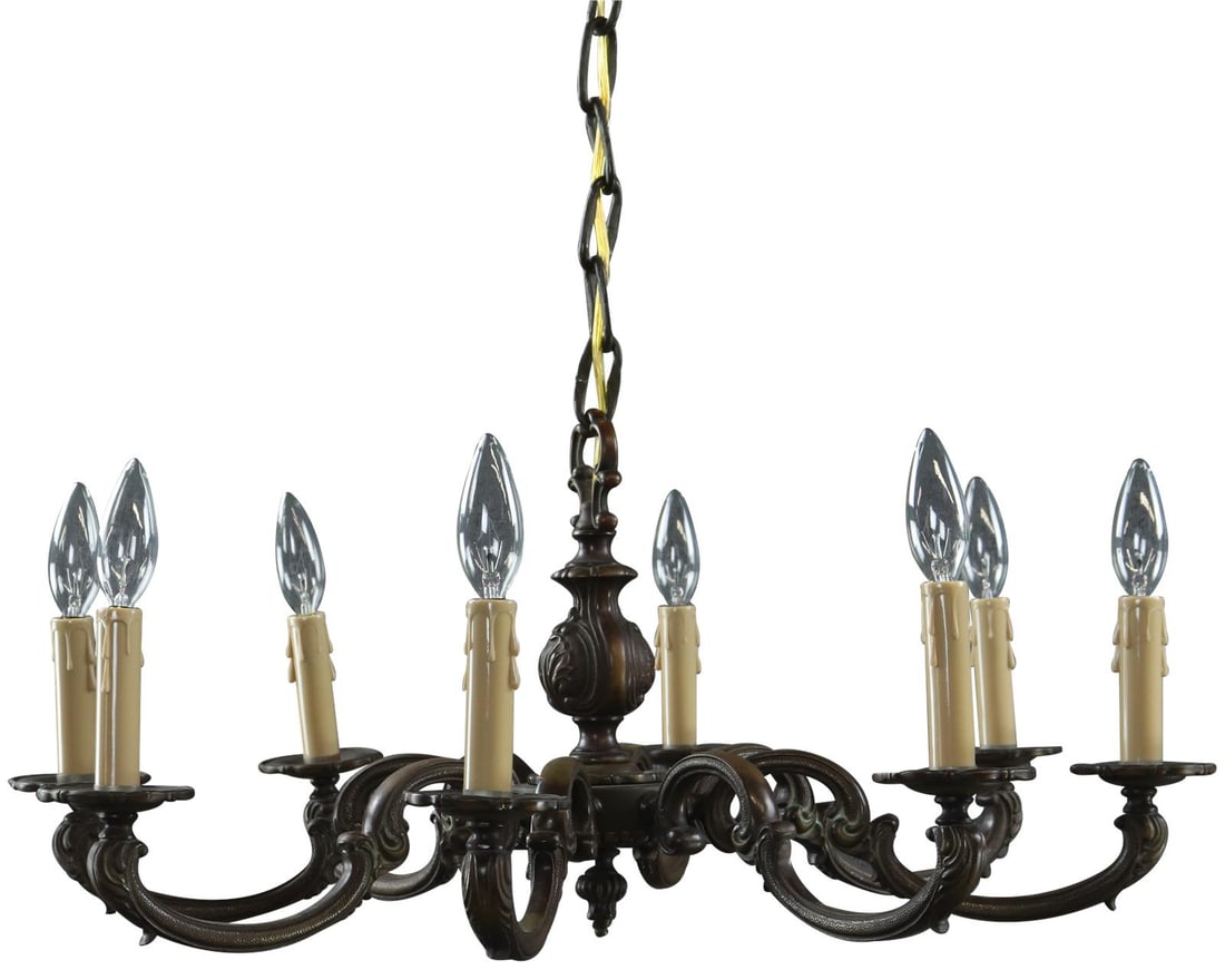 Vintage French Rococo Brass Chandelier with 8 Electric Candle Lights: Vintage French Rococo Brass Chandelier with 8 Electric Candle Lights Experience the elegance of a bygone era with this Vintage French Rococo Brass Chandelier, crafted in France circa 1930. This stunni