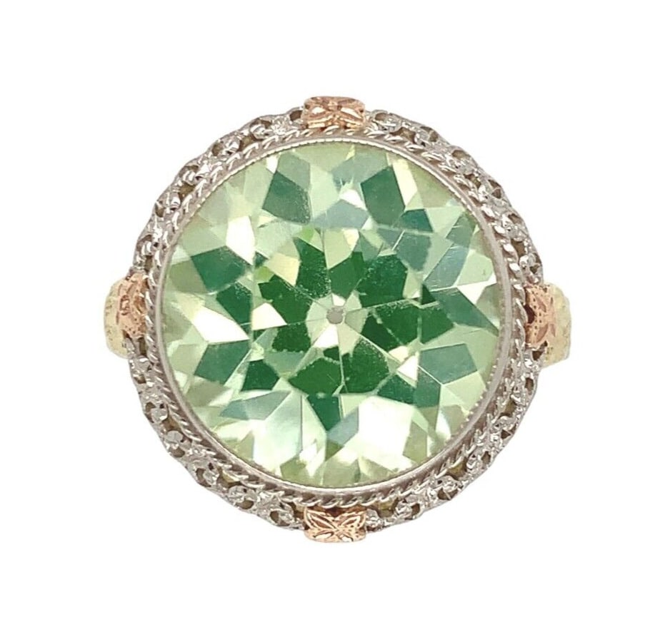 Filigree 14k Gold Ring with Lab-Created Spinel and Uranium/Vaseline Stone: Filigree 14k Gold Ring with Lab-Created Spinel and Uranium/Vaseline Stone This exquisite filigree ring showcases an intricate design crafted from 14k white gold, enhanced with applied rose and yellow 