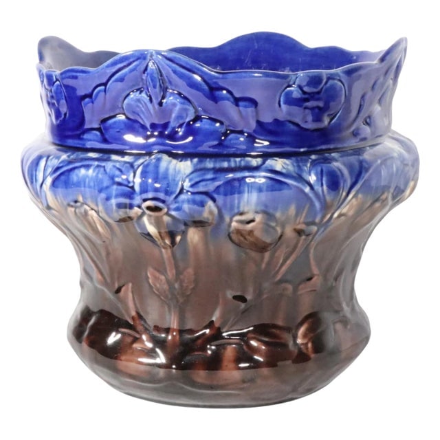 Antique Brush McCoy Majolica Planter in Brown and Blue Glaze: Antique Brush McCoy Majolica Planter in Brown and Blue Glaze This antique Brush McCoy majolica planter showcases a beautiful graduated brown and blue glaze, complemented by a raised relief surface ado