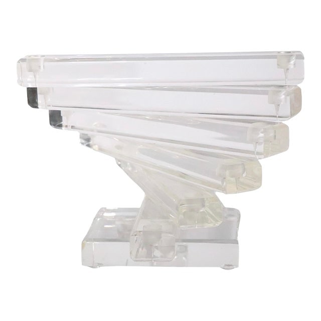 Chic Vintage Hollywood Regency Lucite Candelabra 1970s: Chic Vintage Hollywood Regency Lucite Candelabra 1970s This chic vintage lucite candlestick showcases a striking Hollywood Regency style with its unique swirl form. Designed in the 1970s, it features