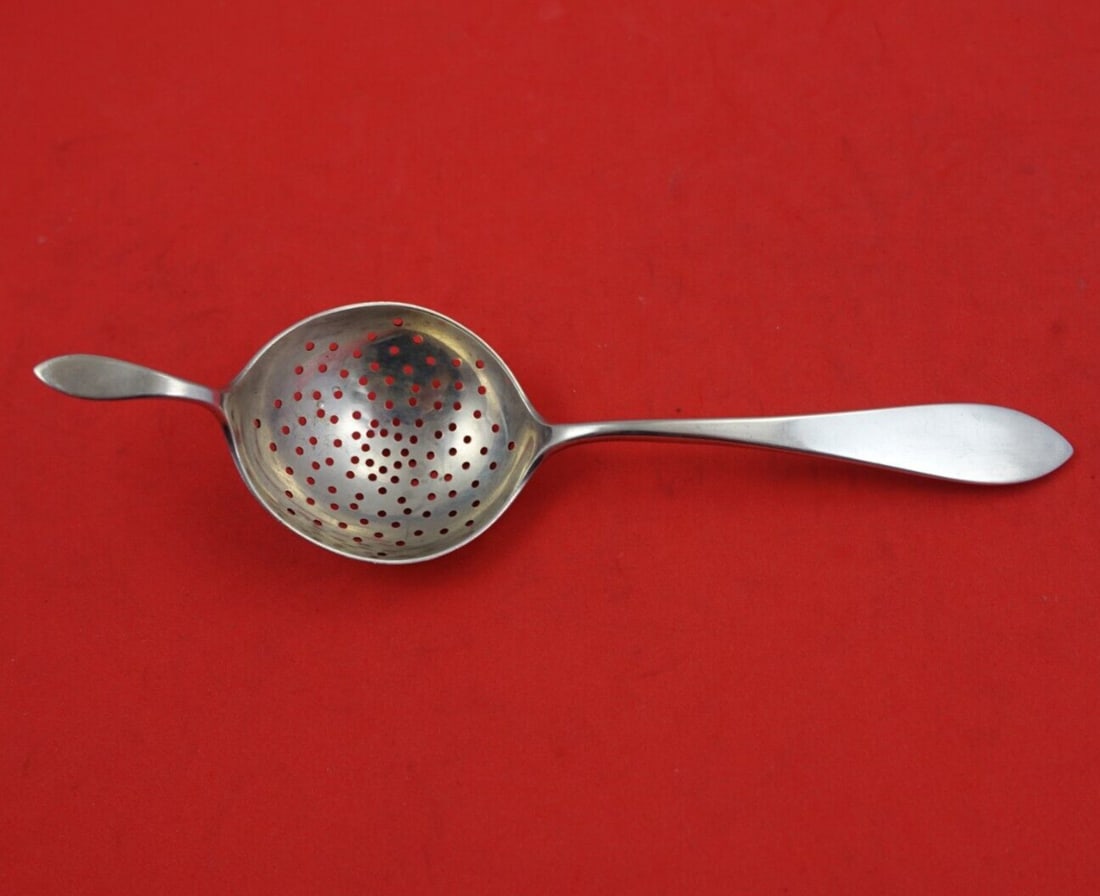 Old Newbury Sterling Silver Tea Strainer 5 7/8": Old Newbury Sterling Silver Tea Strainer 5 7/8" This exquisite tea strainer from Old Newbury Crafters is crafted in sterling silver and showcases the elegant Old Newbury pattern. Measuring 5 7/8 inche