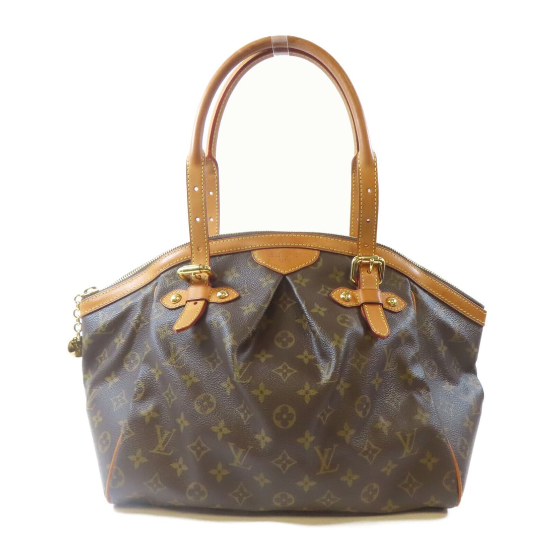 Louis Vuitton Tivoli GM Shoulder Bag Monogram Brown: Louis Vuitton Tivoli GM Shoulder Bag Monogram Brown This LOUIS VUITTON Tivoli GM Shoulder Handbag (M40144) features a stylish monogram pattern complemented by leather accents. The exterior is crafted 