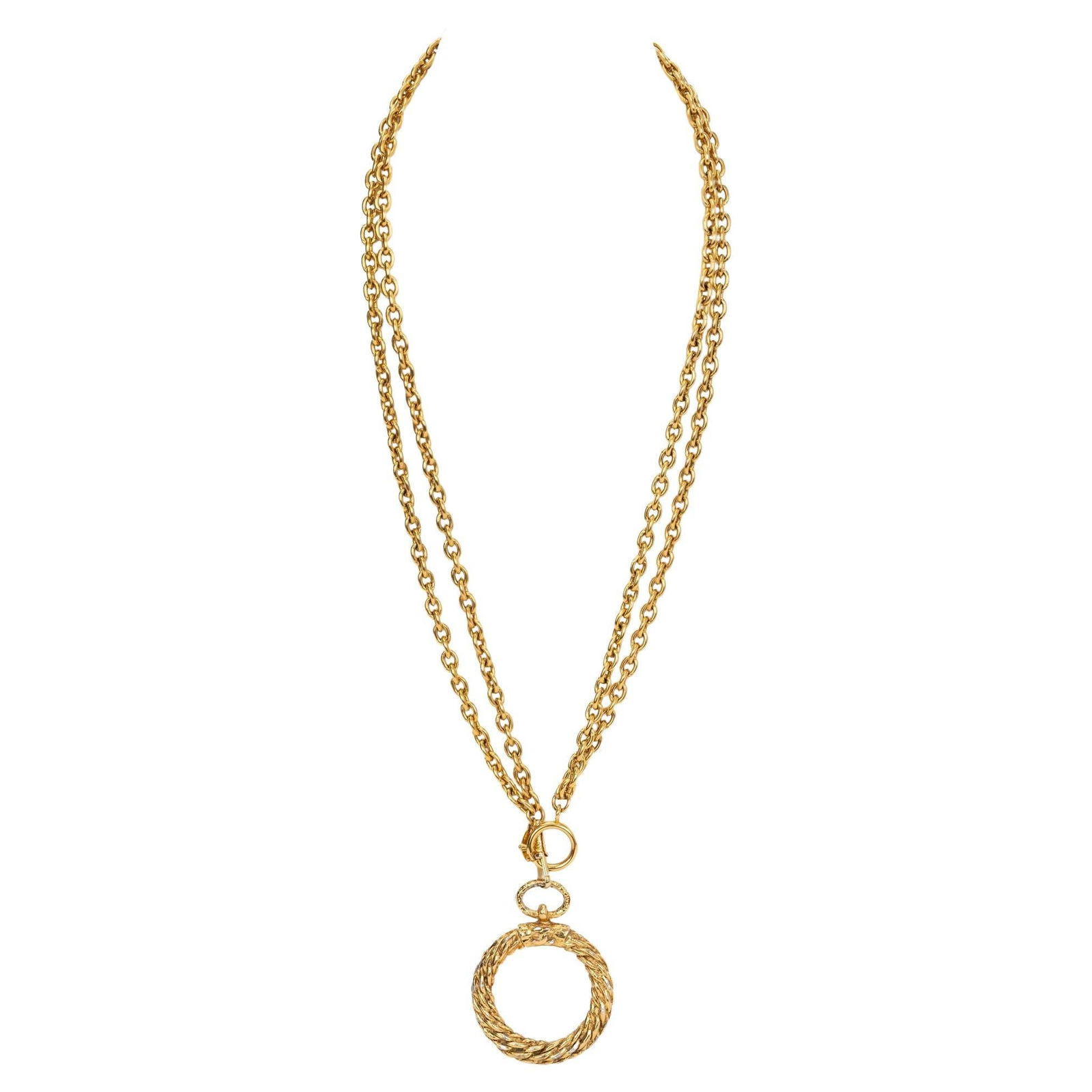 Chanel 80s Gold Plate Loupe Necklace: Chanel 80s Gold Plate Loupe Necklace This stunning Chanel Loupe Necklace from the 1980s features a beautiful gold plate finish, creating an elegant and eye-catching accessory. Designed with a double c
