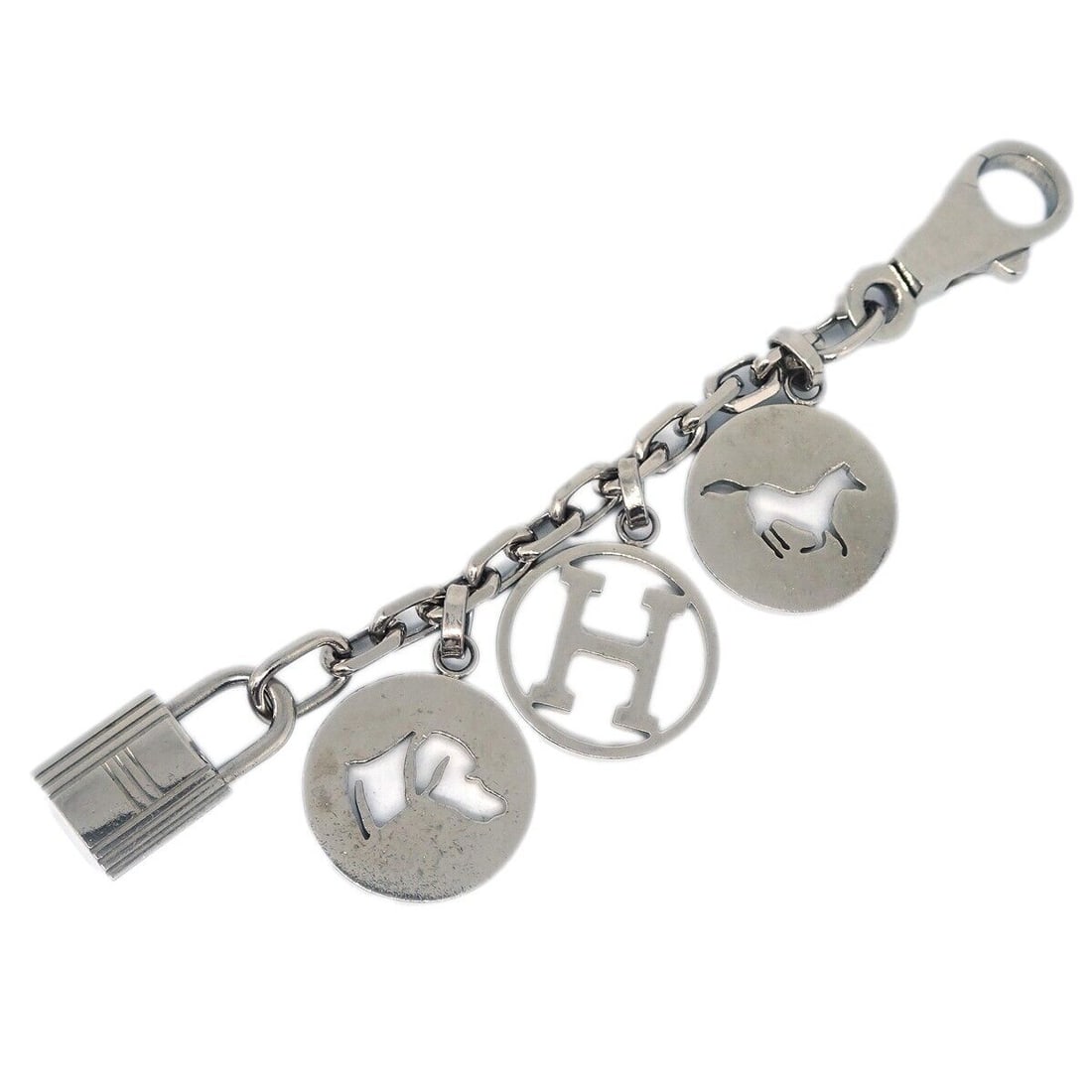 Hermes Amulet Bull Lock Key Holder Bag Charm Silver Plated: Hermes Amulet Bull Lock Key Holder Bag Charm Silver Plated This exquisite Hermes Amulet Bull Lock Key Holder Bag Charm is a stylish accessory for your handbag. Crafted from silver-plated material, thi