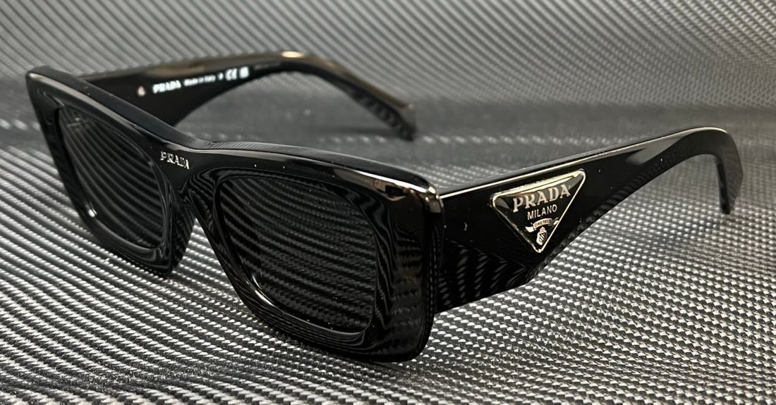 Black Cat Eye Sunglasses PRADA 50 mm: Black Cat Eye Sunglasses PRADA 50 mm Elevate your style with these PRADA PR 13ZS sunglasses, featuring a chic cat-eye design. The sleek black plastic frame complements the gray lenses, ensuring you lo