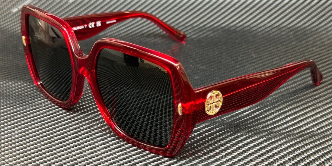 Tory Burch Transparent Red Women's Sunglasses: Tory Burch Transparent Red Women's Sunglasses Elevate your style with these Tory Burch TY7191U sunglasses, featuring a chic transparent red square frame. The dark lenses offer a perfect blend of fashi
