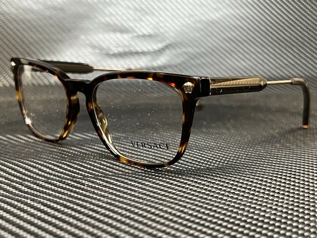 Versace VE3290 5337 Brown Women's Eyeglasses 54 mm: Versace VE3290 5337 Brown Women's Eyeglasses 54 mm Introducing the Versace VE3290 women's eyeglasses, designed for those who appreciate luxury and style. These eyeglasses feature a stunning tortoisesh