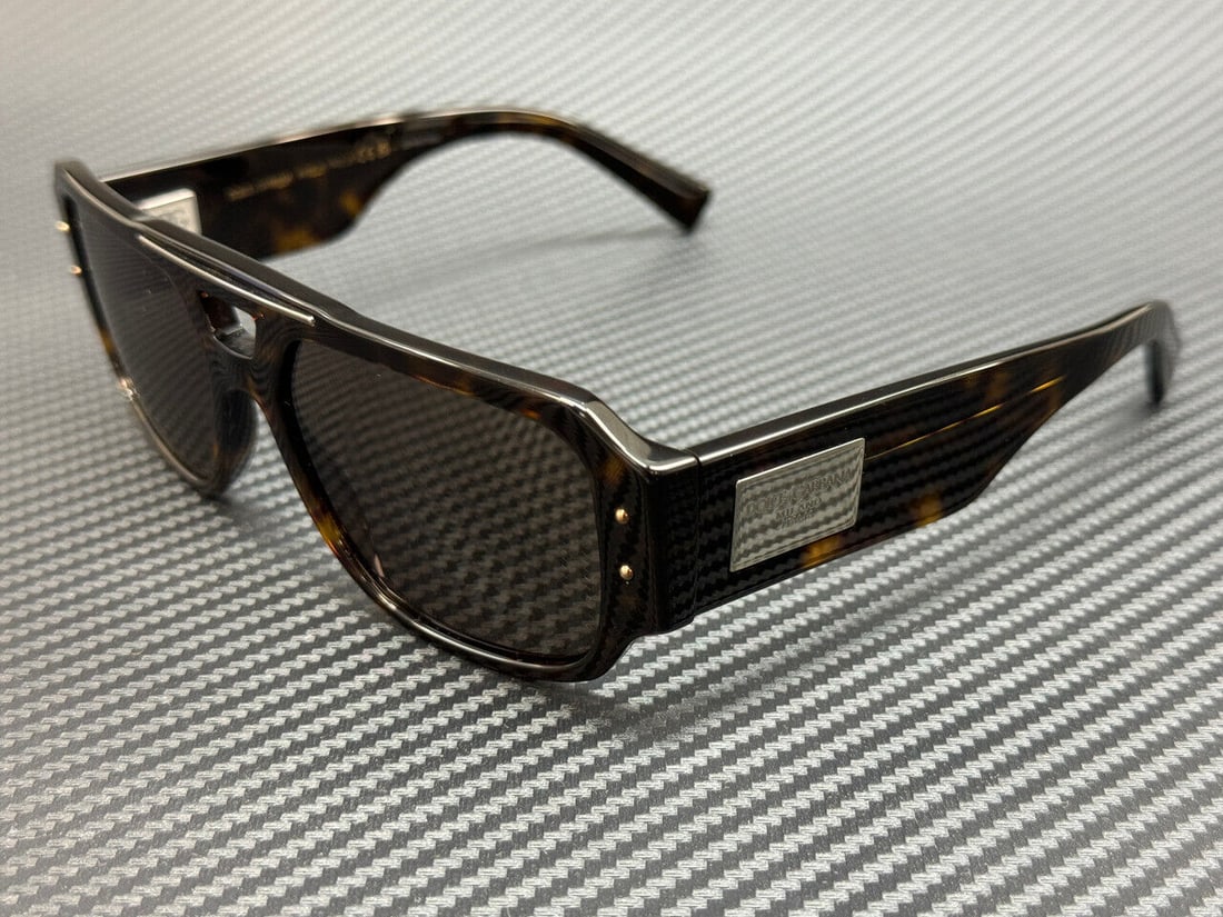 DOLCE & GABBANA DG4482 502 73 Brown Men's Sunglasses: DOLCE & GABBANA DG4482 502 73 Brown Men's Sunglasses Elevate your style with these Dolce & Gabbana DG4482 sunglasses. Featuring a sophisticated Havana brown tortoiseshell frame and dark lenses, these