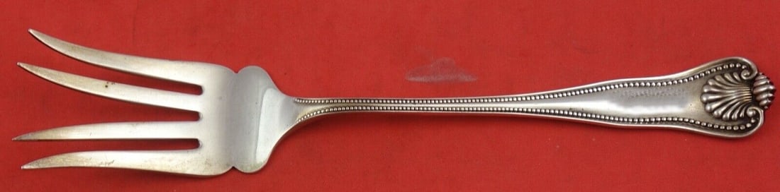 Newport Shell Sterling Silver Beef Fork with Splayed Tines 6 5/8": Newport Shell Sterling Silver Beef Fork with Splayed Tines 6 5/8" This exquisite beef fork features the elegant Newport Shell pattern by Frank Smith, crafted from high-quality sterling silver. The for