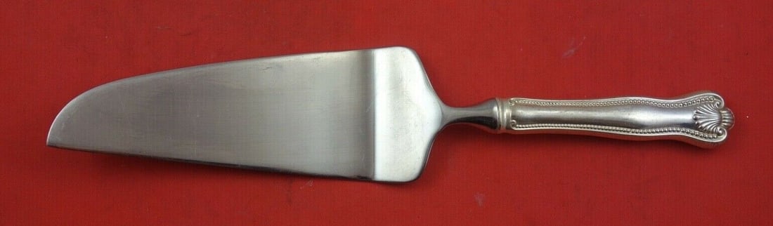 Newport Shell Sterling Silver Pie Server 10 3/4": Newport Shell Sterling Silver Pie Server 10 3/4" This exquisite pie server features the elegant Newport Shell pattern by Frank Smith, crafted from high-quality sterling silver. The hollow handle adds