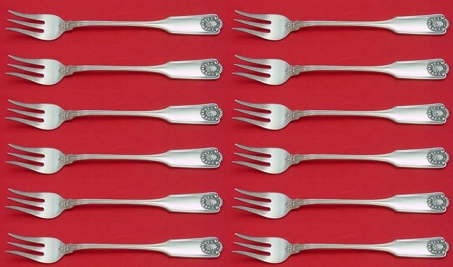Fiddle Shell Sterling Silver Cocktail Fork Set 12 pcs 5 1/2": Fiddle Shell Sterling Silver Cocktail Fork Set 12 pcs 5 1/2" This exquisite 12-piece cocktail fork set features the elegant Fiddle Shell pattern by Frank Smith, crafted from high-quality sterling silv