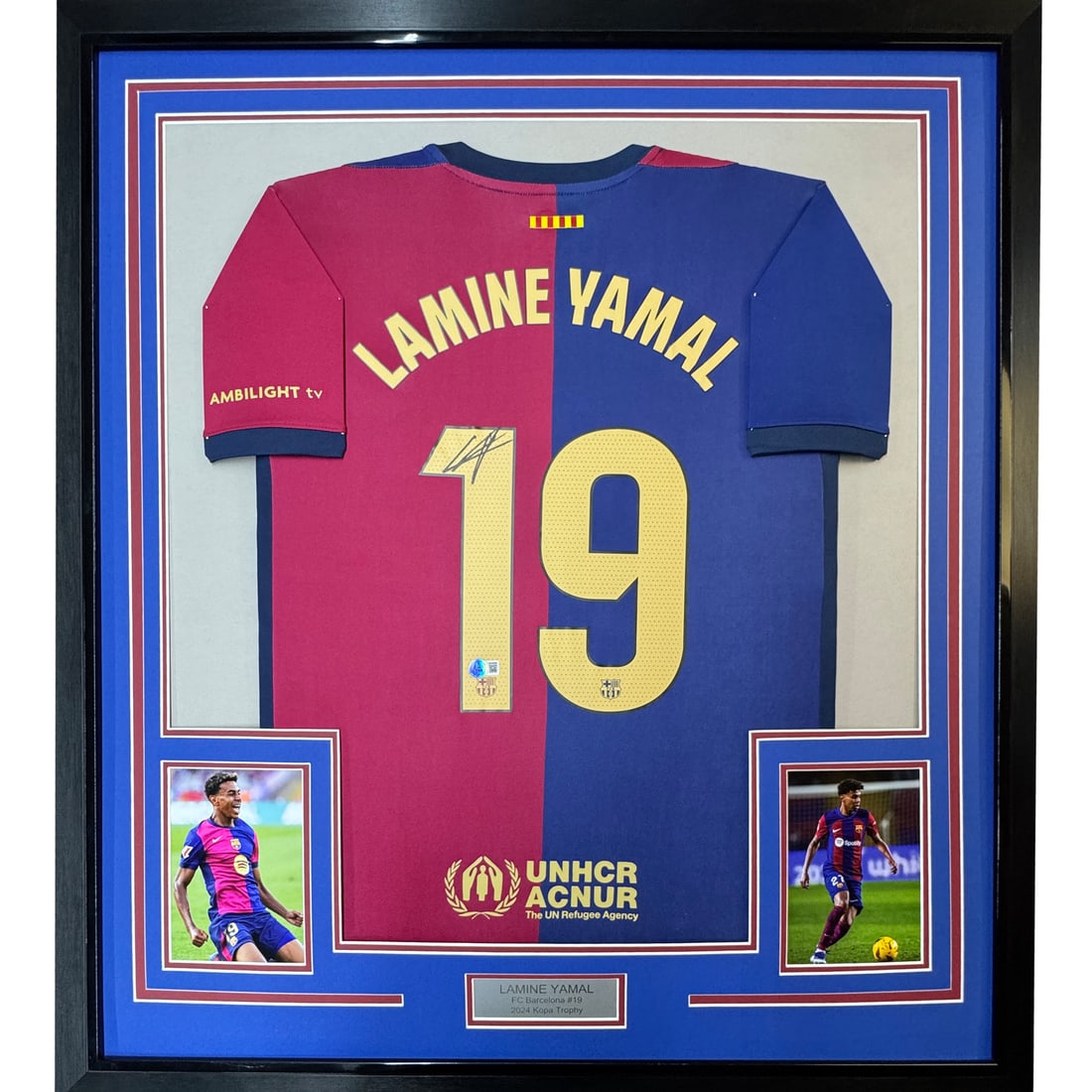 Framed Autographed Lamine Yamal 35x39 FC Barcelona Jersey with Photos: Framed Autographed Lamine Yamal 35x39 FC Barcelona Jersey with Photos This framed FC Barcelona jersey features the name 'LAMINE YAMAL' and the number '19', showcasing an authentic signature from the a