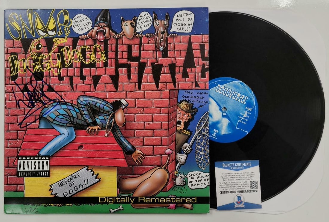 Signed Snoop Dogg Doggystyle Vinyl Album with Beckett COA: Signed Snoop Dogg Doggystyle Vinyl Album with Beckett COA This is an original vinyl record album of 'Doggystyle' by Snoop Dogg, featuring vibrant cartoon cover art. The album is signed on the front co