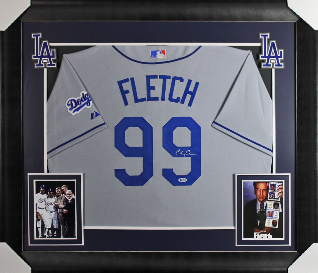 Chevy Chase Fletch Signed & Framed Grey Dodgers Jersey BAS Witnessed: Chevy Chase Fletch Signed & Framed Grey Dodgers Jersey BAS Witnessed This is a pre-owned, signed and framed Los Angeles Dodgers jersey featuring the name 'FLETCH' and the number '99'. The jersey is au