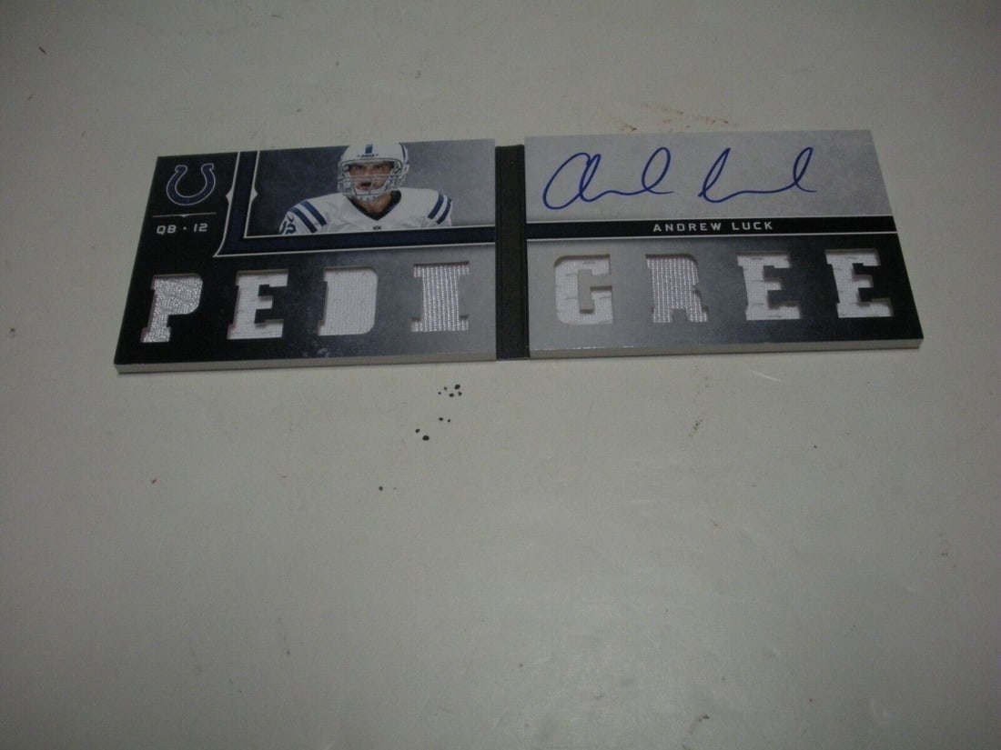 Andrew Luck 2013 Panini Playbook Game Used 8 Piece Jersey Auto 29/99 Card: Andrew Luck 2013 Panini Playbook Game Used 8 Piece Jersey Auto 29/99 Card This collectible card features Andrew Luck, a prominent NFL quarterback, showcasing a game-used jersey piece along with his si