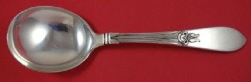 Tulipan Sterling Silver Gumbo Soup Spoon 7": Tulipan Sterling Silver Gumbo Soup Spoon 7" This exquisite Tulipan gumbo soup spoon, crafted by Frank Smith, showcases the elegant design of its namesake pattern. Made of high-quality sterling silver,
