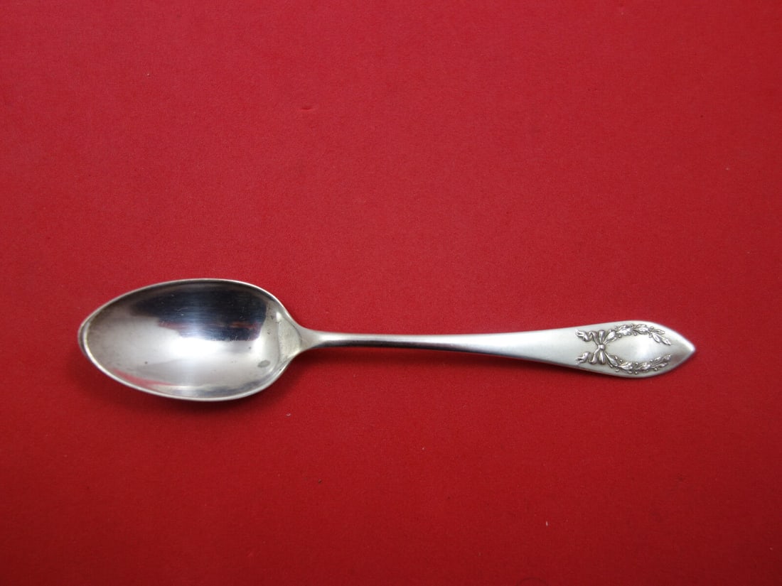 Laurel Sterling Silver Demitasse Spoon 4 3/8": Laurel Sterling Silver Demitasse Spoon 4 3/8" This exquisite demitasse spoon features the elegant Laurel pattern by Frank Smith, crafted from high-quality sterling silver. Measuring 4 3/8" in length,