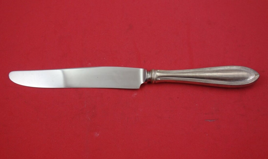 Pilgrim Sterling Silver Dinner Knife French 9 5/8": Pilgrim Sterling Silver Dinner Knife French 9 5/8" This is a beautiful dinner knife from the 'Pilgrim' pattern by Frank Smith, crafted in sterling silver. Measuring 9 5/8 inches, this piece showcases
