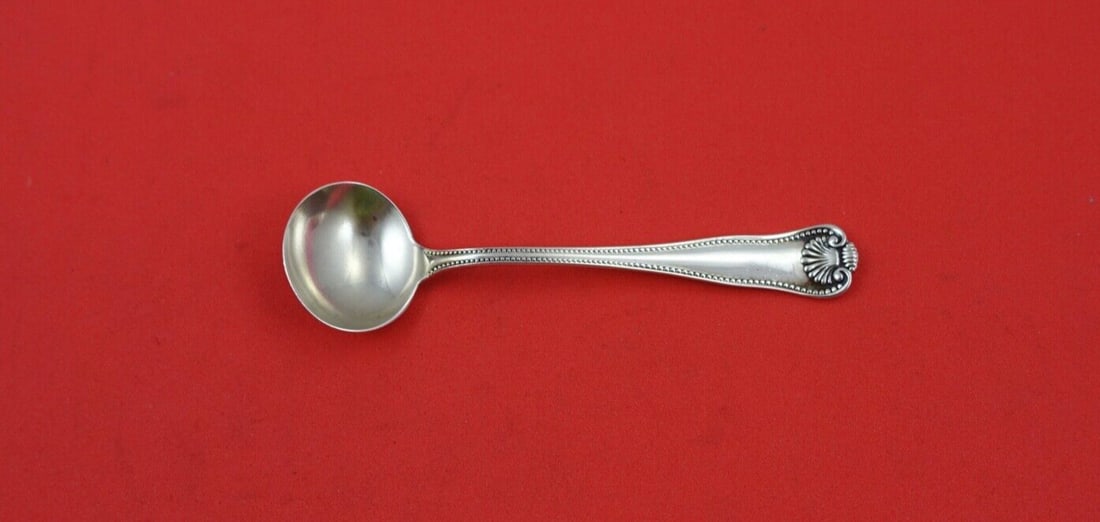 Newport Shell Sterling Silver Salt Spoon Master 3 5/8": Newport Shell Sterling Silver Salt Spoon Master 3 5/8" This exquisite Newport Shell salt spoon, crafted by Frank Smith, features a beautifully decorative handle and is made of sterling silver. Measuri