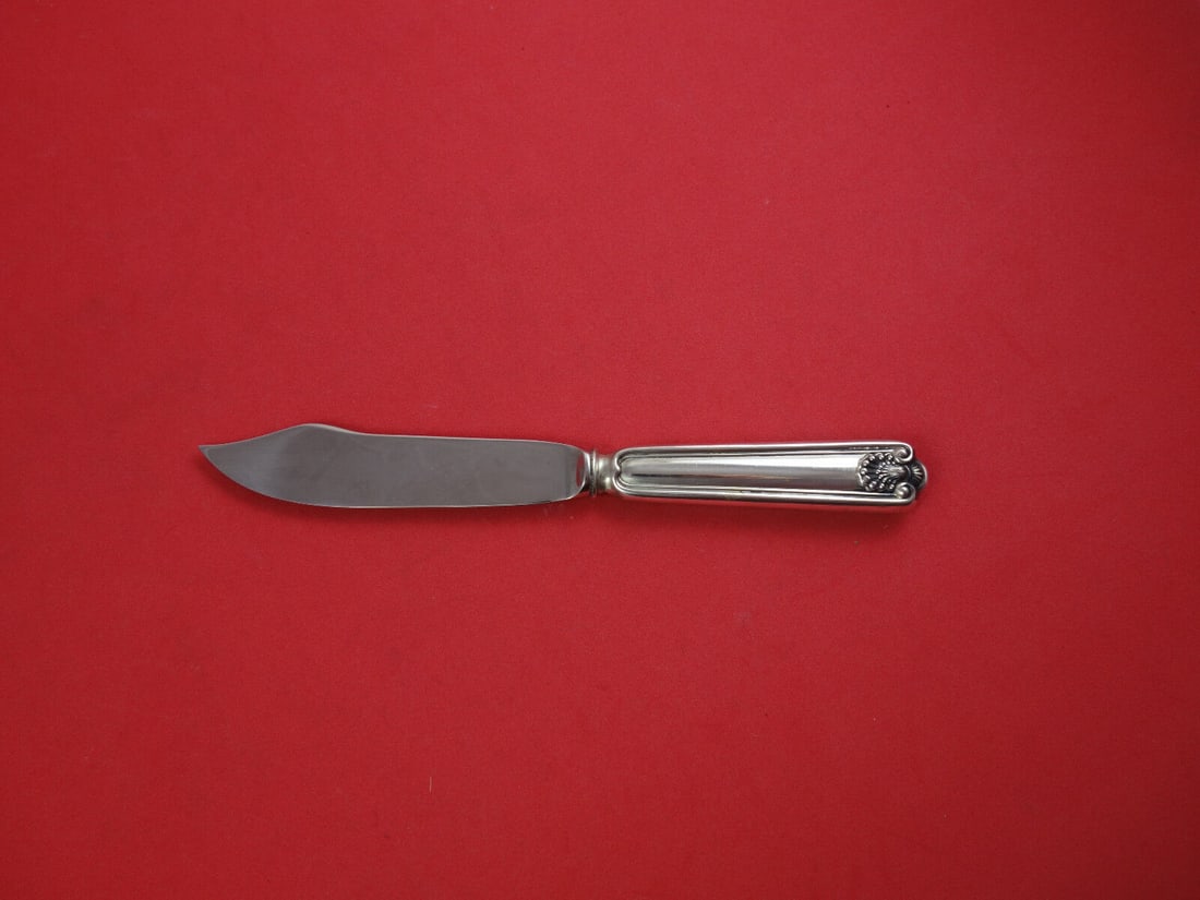 Fiddle Shell Sterling Silver Fish Knife 7 3/4": Fiddle Shell Sterling Silver Fish Knife 7 3/4" This exquisite fish knife from the Fiddle Shell pattern by Frank Smith features a hollow handle crafted from sterling silver, paired with a durable stain