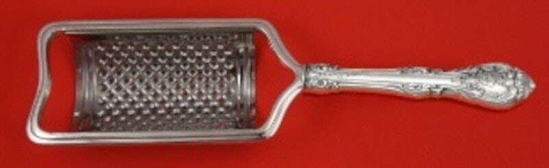 Gorham King Edward Sterling Silver Cheese Grater Curved 8 1/2": Gorham King Edward Sterling Silver Cheese Grater Curved 8 1/2" Enhance your dining experience with the exquisite King Edward cheese grater by Gorham, crafted from high-quality sterling silver. This cu