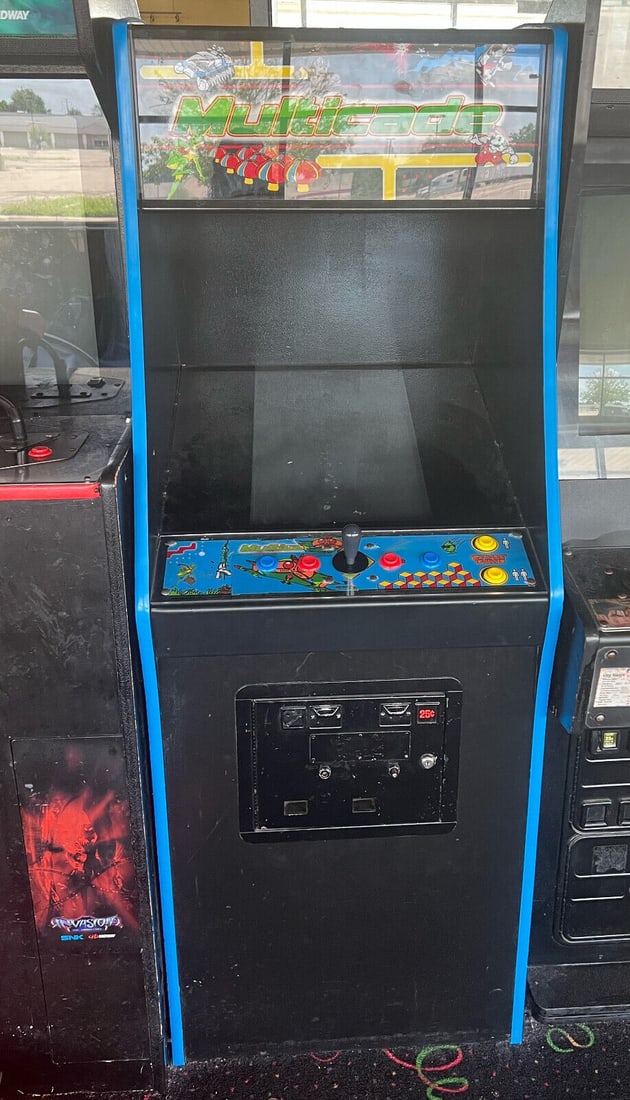 MULTICADE ARCADE MACHINE (Pre-Owned): MULTICADE ARCADE MACHINE (Pre-Owned) This Multicade Arcade Machine is a fantastic addition for gaming enthusiasts, featuring a sleek cabinet design that supports two players. Manufactured in 2008, thi