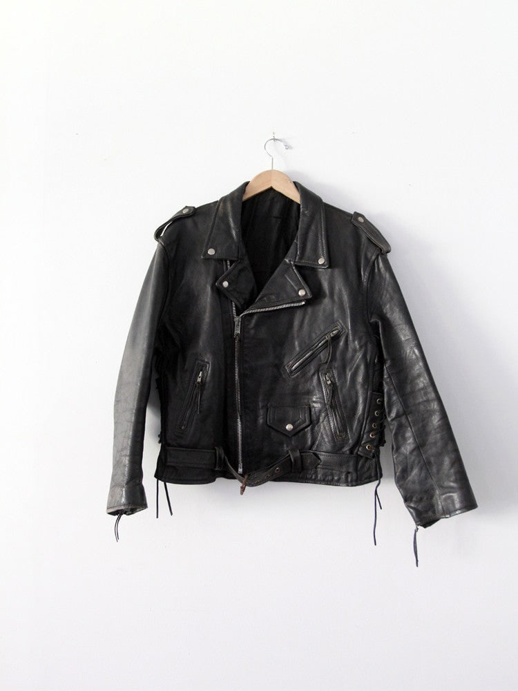 Vintage 1970s Black Leather Motorcycle Jacket: Vintage 1970s Black Leather Motorcycle Jacket Discover this striking 1970s vintage black leather motorcycle jacket, a true statement piece from our Stylist's Collection. Crafted from heavy black leath