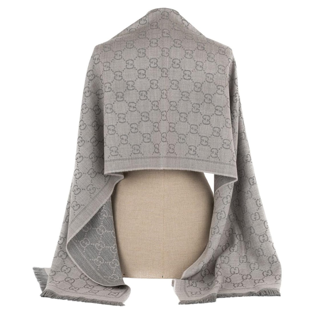 Gucci Grey Wool Shawl with GG Monogram 20 x 72 in: Gucci Grey Wool Shawl with GG Monogram 20 x 72 in Elevate your style with this exquisite Gucci New Monogram Grey Shawl. Crafted from high-quality wool, this shawl features a sophisticated grey hue ado