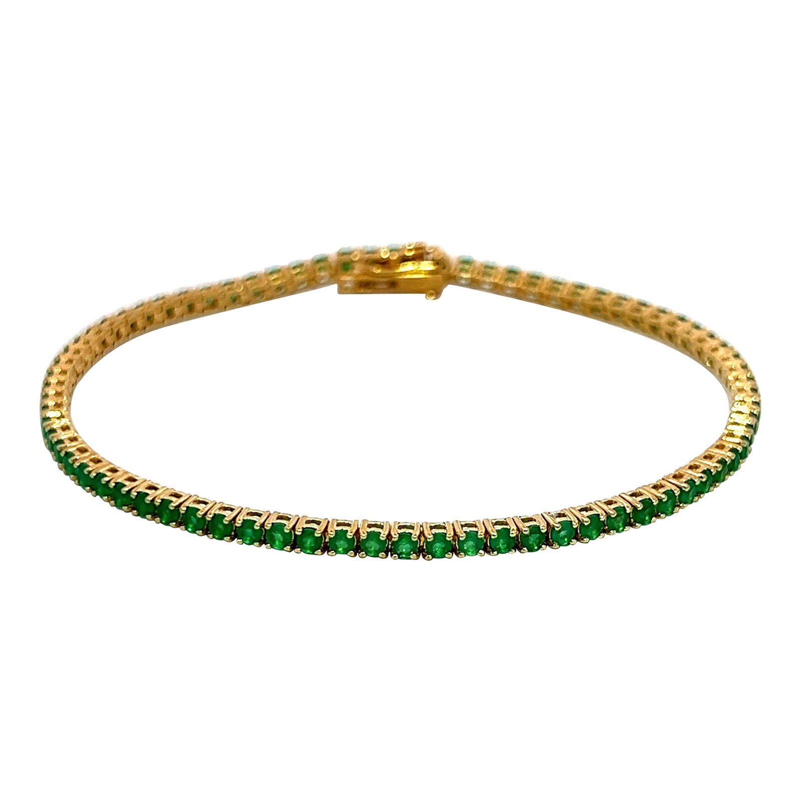 2.45ct Tsavorite Tennis Bracelet 18k Yellow Gold 7in Contemporary: 2.45ct Tsavorite Tennis Bracelet 18k Yellow Gold 7in Contemporary This stunning tennis bracelet features 75 round-cut green tsavorite garnets, totaling 2.45 carats, elegantly set in 18k yellow gold. W