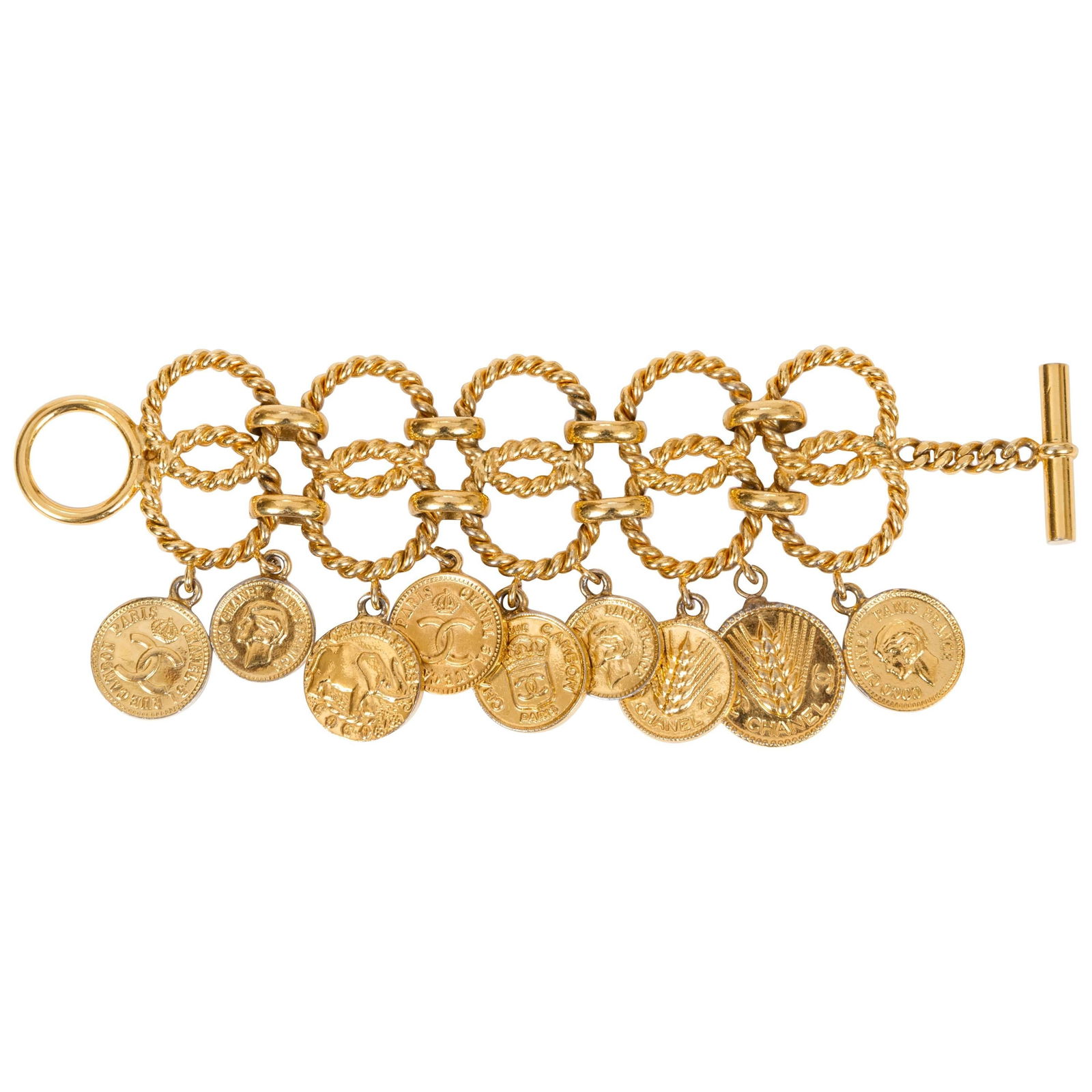 Chanel 1985 Rare Double Chain Coin Charm Bracelet 8 in: Chanel 1985 Rare Double Chain Coin Charm Bracelet 8 in This exquisite Chanel bracelet from the mid-1980s features a unique double chain design adorned with Roman coin charms, showcasing a blend of vin