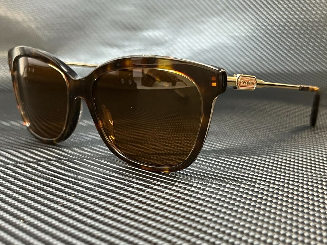 COACH HC8305 Cat Eye Sunglasses Dark Tortoise 57mm Women's: COACH HC8305 Cat Eye Sunglasses Dark Tortoise 57mm Women's Elevate your style with these COACH HC8305 sunglasses, featuring a chic cat eye design in a sophisticated dark tortoise finish. With a frame