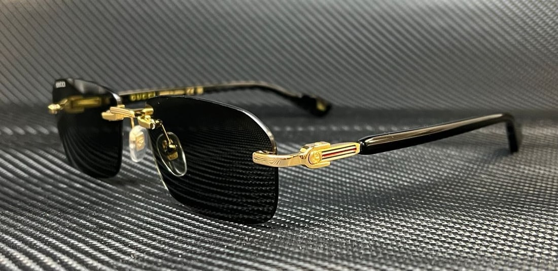 GUCCI GG1221S Rimless Black Metal Sunglasses 56mm L Designer Classic: GUCCI GG1221S Rimless Black Metal Sunglasses 56mm L Designer Classic Elevate your eyewear collection with these GUCCI GG1221S sunglasses, designed for the modern man. Featuring a striking black frame
