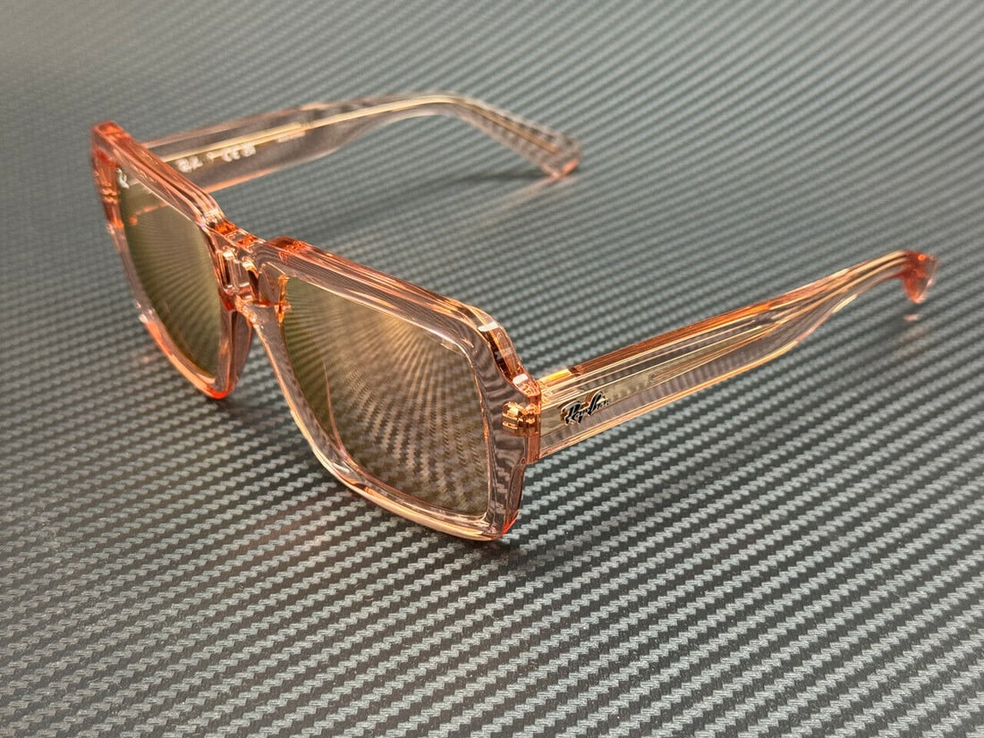 Ray-Ban RB4408 Transparent Pink 54mm Unisex Sunglasses: Ray-Ban RB4408 Transparent Pink 54mm Unisex Sunglasses Introducing the Ray-Ban RB4408 Sunglasses, featuring a stylish transparent pink frame that adds a touch of fun and sophistication to your look. W