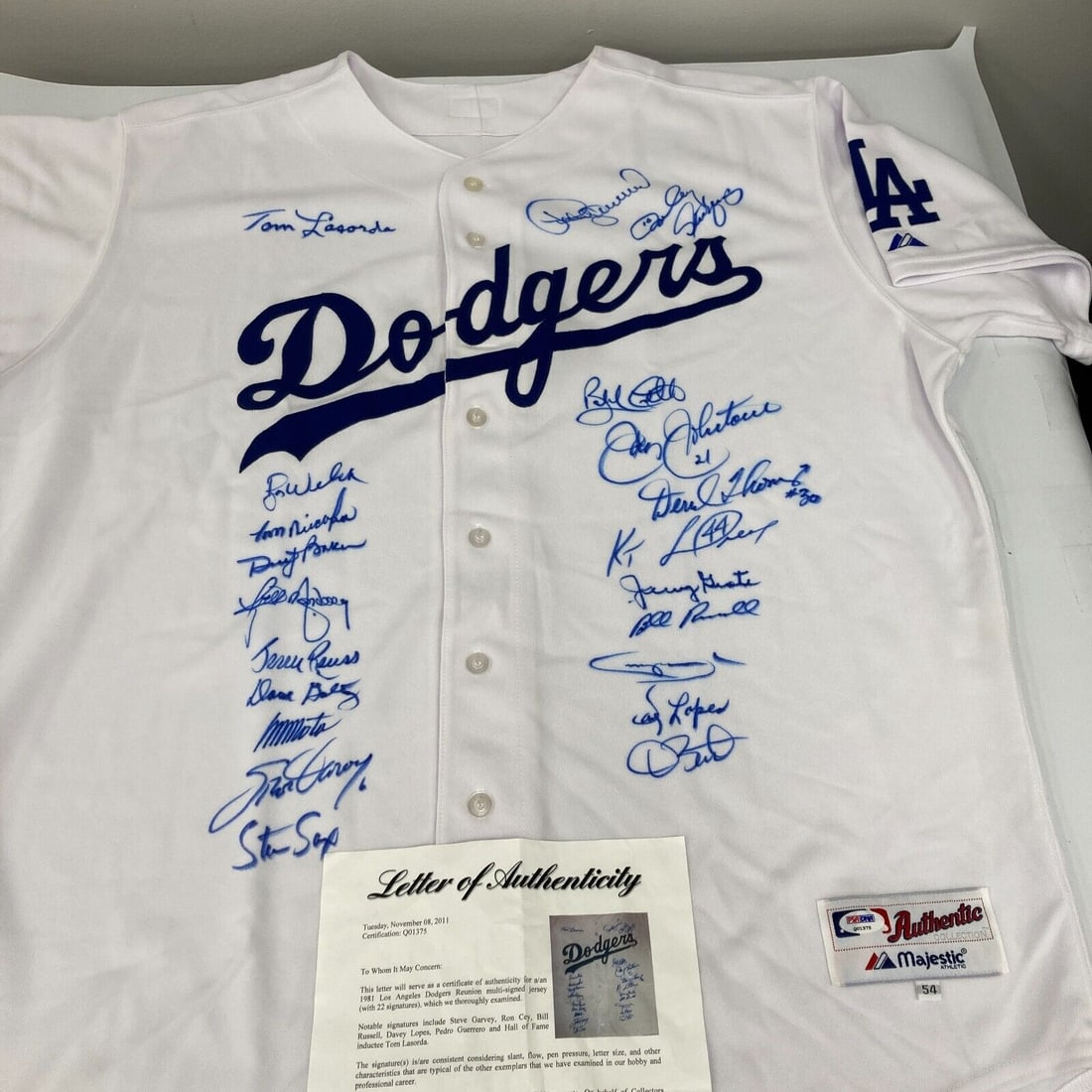 1981 Dodgers Team Signed Jersey with PSA DNA COA: 1981 Dodgers Team Signed Jersey with PSA DNA COA Celebrate the legacy of the 1981 Los Angeles Dodgers with this original team signed jersey. This exceptional piece of memorabilia features the bold sig