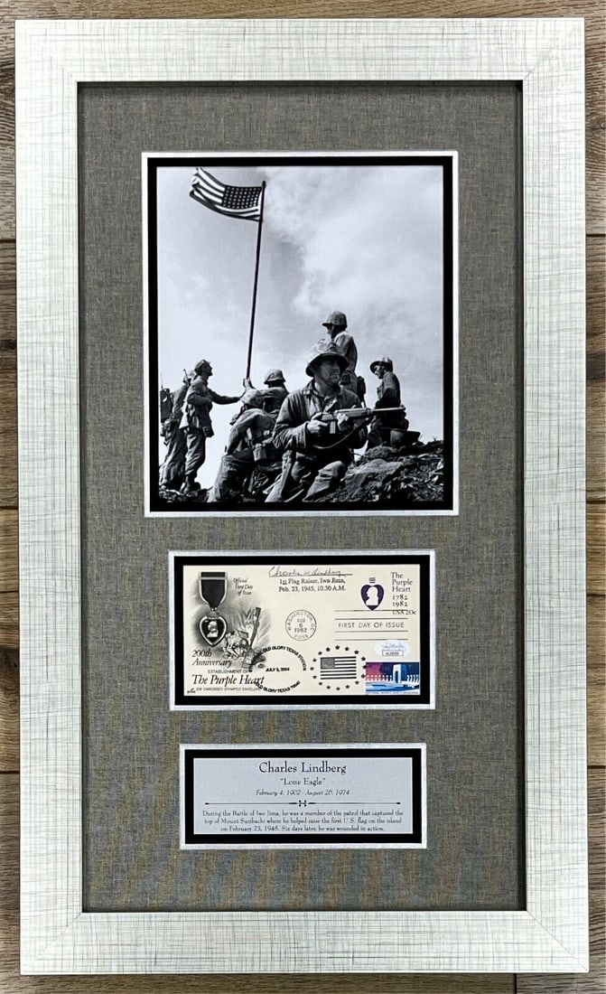 Charles W Lindberg Signed FDC Framed Display JSA 25 x 15: Charles W Lindberg Signed FDC Framed Display JSA 25 x 15 This professionally framed First Day Cover commemorates the 200th Anniversary of the Purple Heart Award and is signed by Charles W. Lindberg, t