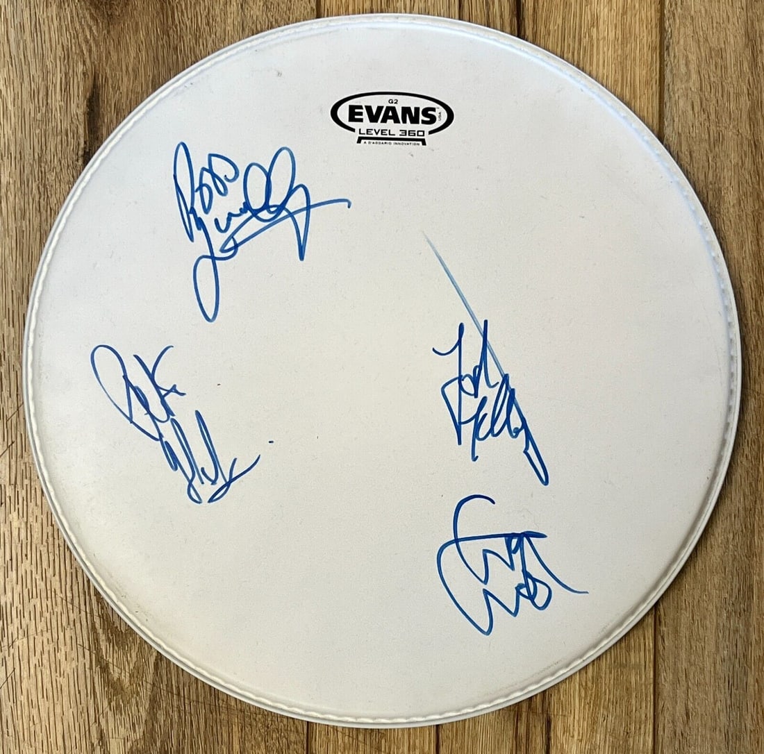 The Strypes Signed 14 Inch Evans Drum Head with Authentication: The Strypes Signed 14 Inch Evans Drum Head with Authentication Own a piece of music history with this 14-inch Evans drum head, expertly signed by the acclaimed Irish band The Strypes. This authentic d