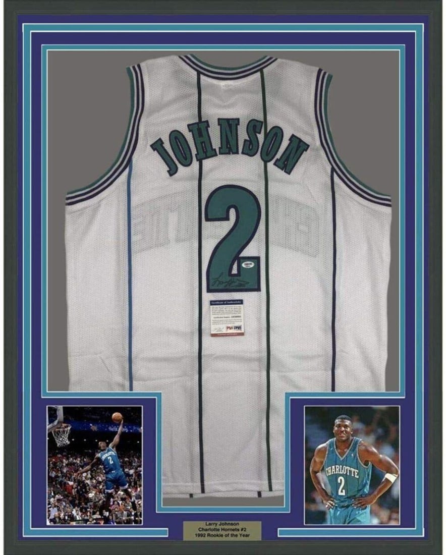 Framed Autographed Larry Johnson 33x42 NBA Jersey PSA/DNA COA: Framed Autographed Larry Johnson 33x42 NBA Jersey PSA/DNA COA This is a framed, autographed jersey of Larry Johnson, a notable player from the NBA's Charlotte Hornets. The jersey measures 33x42 inches
