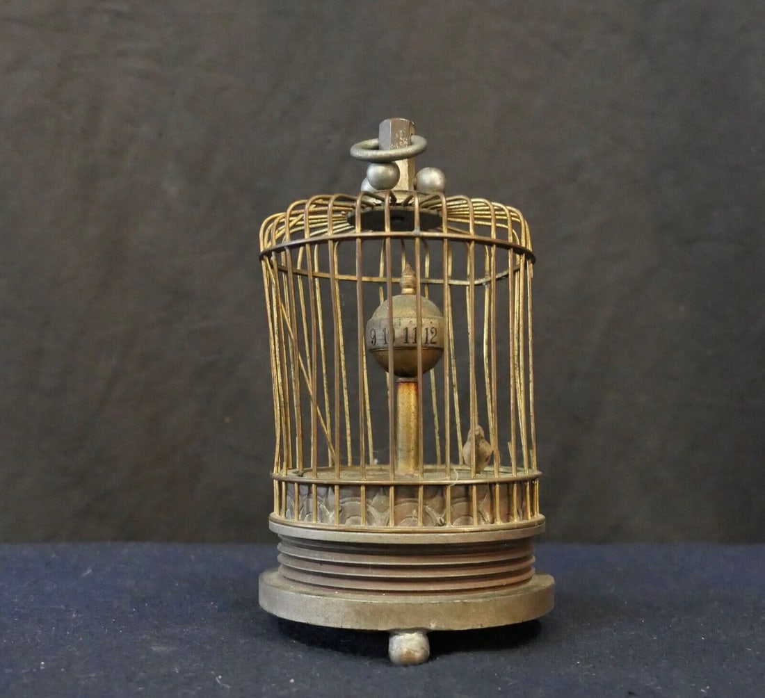 Art Deco Hanging Bird Cage Clock 5 5/8 Vintage Canary: Art Deco Hanging Bird Cage Clock 5 5/8 Vintage Canary This charming Art Deco period miniature clock is designed as a bird cage, featuring a yellow canary. The timepiece does not work, the gilded cage