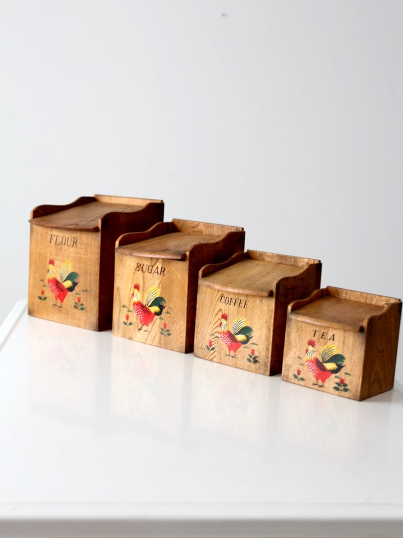 Vintage 1950s Hand-Painted Wooden Rooster Canisters Set: Vintage 1950s Hand-Painted Wooden Rooster Canisters Set Enhance your kitchen with this charming set of Mid-Century Rooster Kitchen Canisters from the 1950s. Each wooden canister is uniquely adorned wi