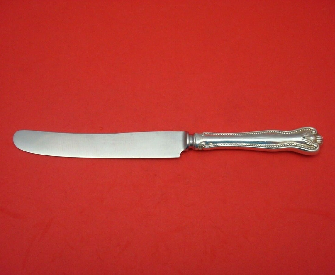 Frank Smith Newport Shell Sterling Silver Dinner Knife 9.5": Frank Smith Newport Shell Sterling Silver Dinner Knife 9.5" This exquisite dinner knife, crafted by Frank Smith, features the elegant Newport Shell pattern. Made from high-quality sterling silver with